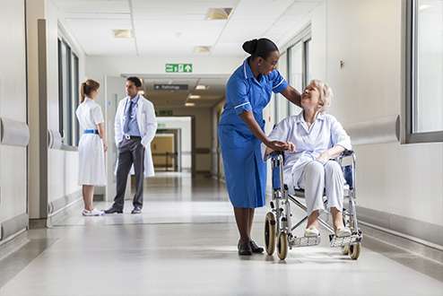 People Sitting In Hospital Lobby